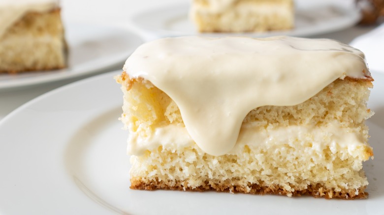 slice of cake topped with creme anglaise