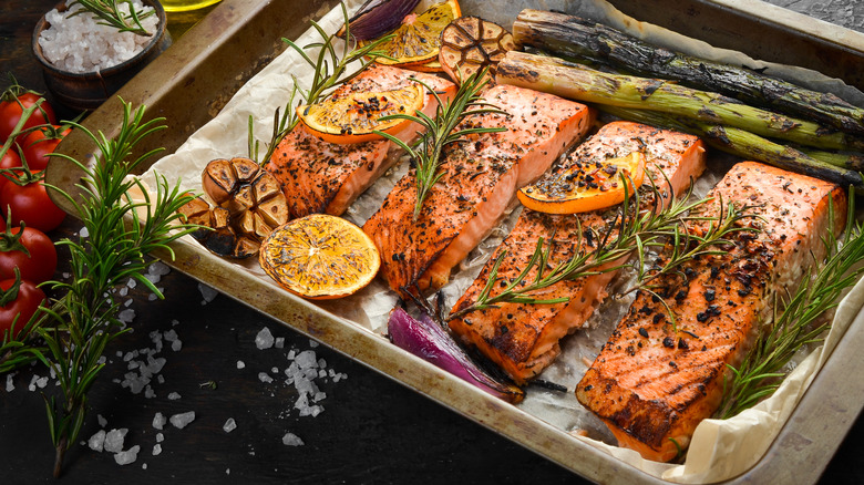 Roasted salmon fillets and asparagus on sheet tray