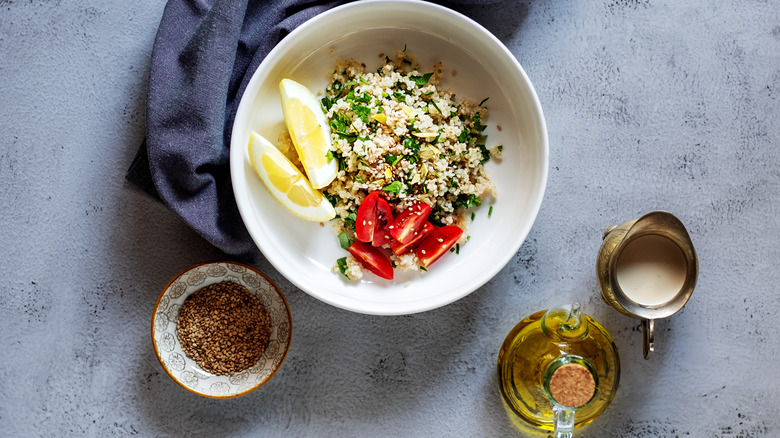 Grain salad with lemon wedges