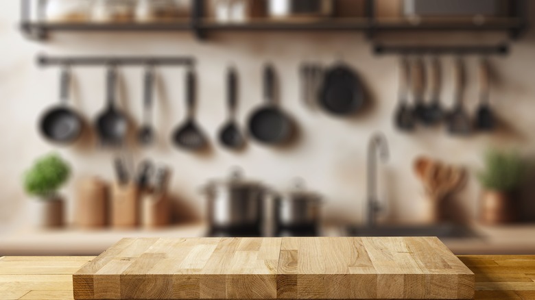 cutting board with hanging pans