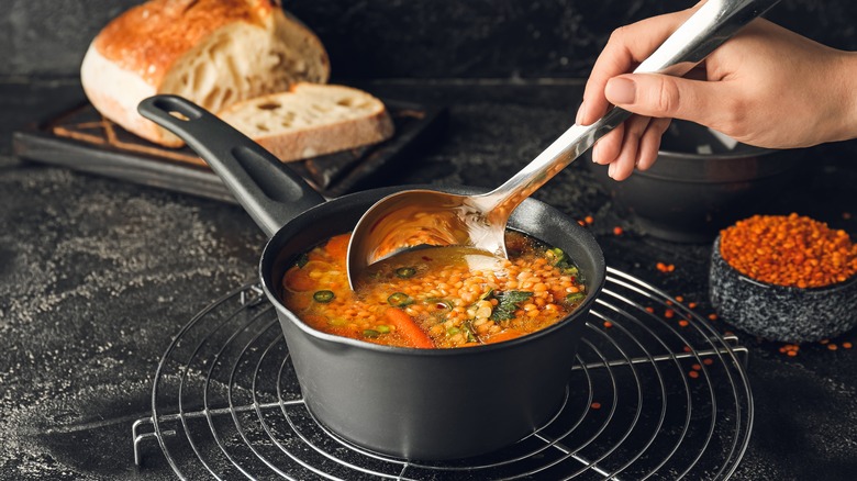 Lentil soup being ladled 