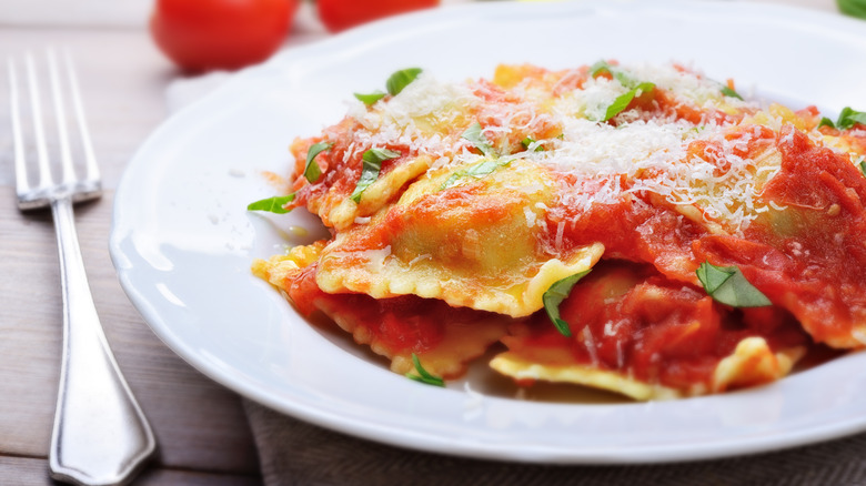 ravioli in tomato sauce on white plate