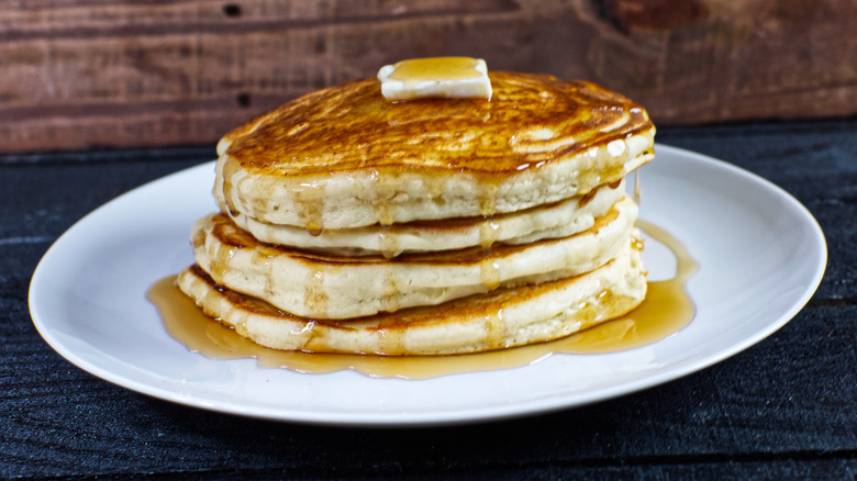 stack of pancakes covered in syrup