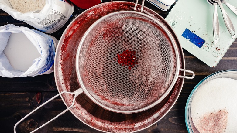 Sifting dry ingredients into a bowl