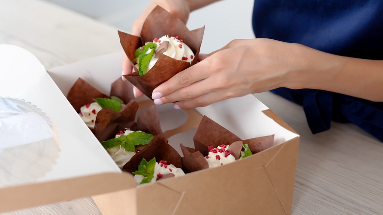 putting cupcakes in box