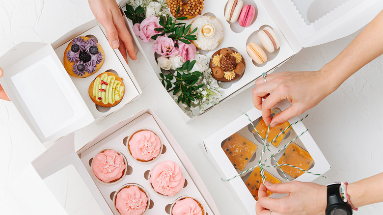 assortment of desserts being boxed up