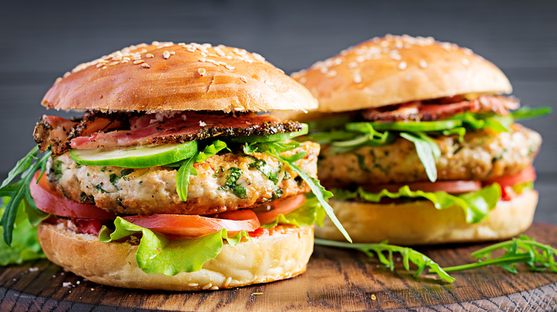 turkey burgers on wooden board 