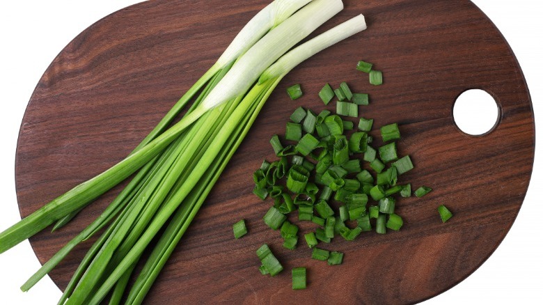 Green onions on cutting board