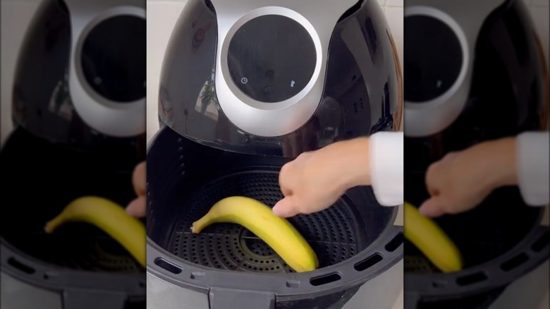 Banana getting placed into an air fryer