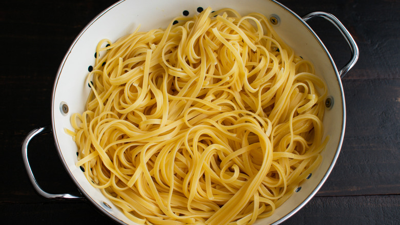 cooked linguine in colander