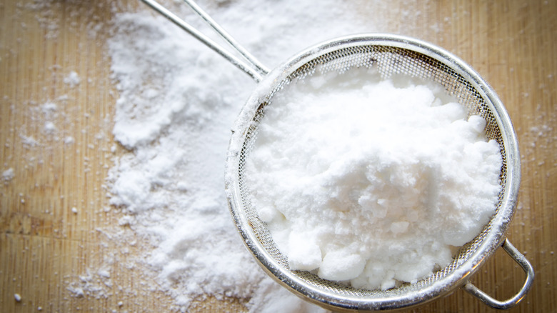 Powdered sugar in a sifter