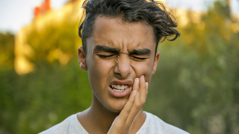 man with tooth pain