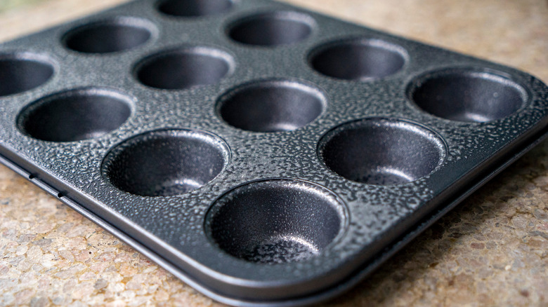 Empty muffin tin on counter