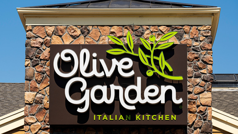 Olive Garden sign on stone wall