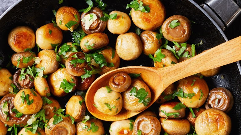 Mushrooms sauteing in a pan