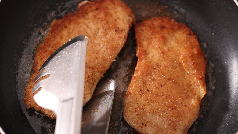 schnitzel pan-frying in a skillet