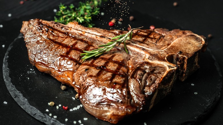 grilled T-bone steak on a cutting board