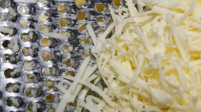 Close up of cheese on rasp grater