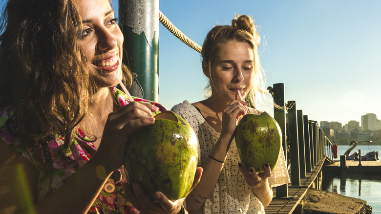 Woman drinking coconut water