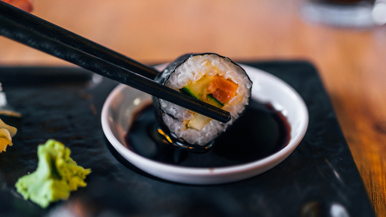 sushi dipped in soy sauce