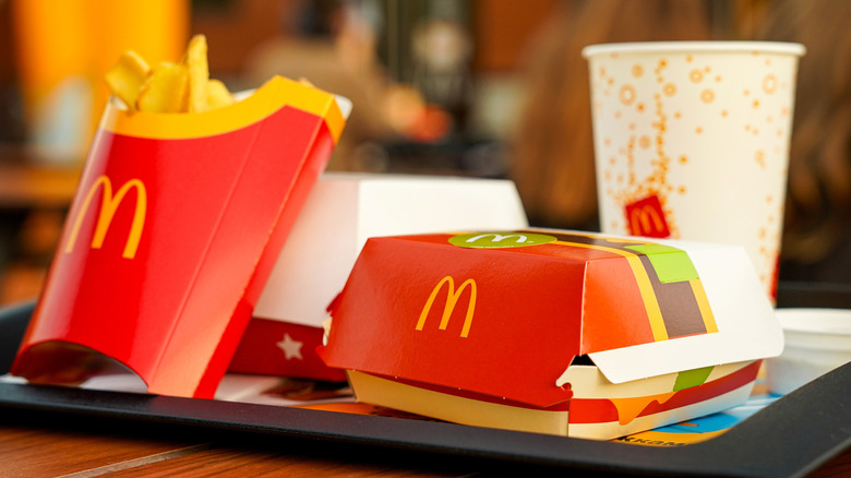 McDonald's meal with cheeseburger box on tray at restaurant