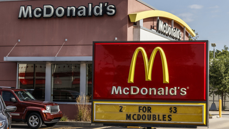 Exterior of a McDonald's restaurant with a sign advertising "2 FOR $3 MCDOUBLES"