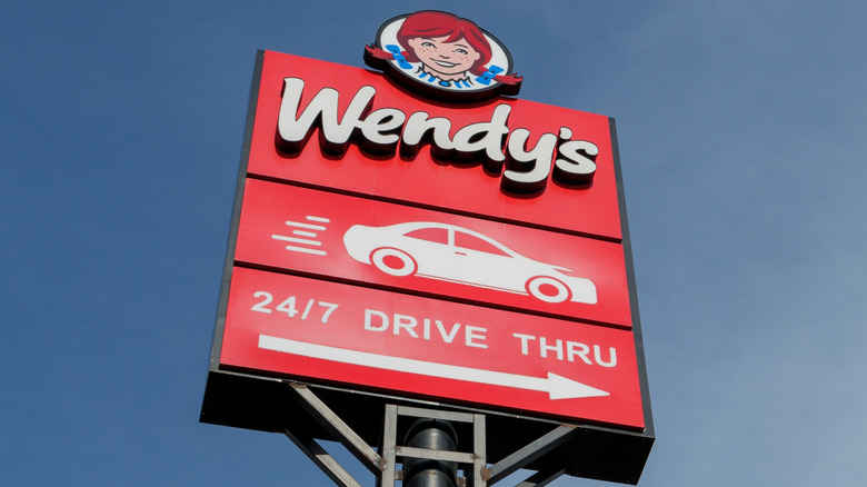 Wendy's drive-thru sign at a low angle