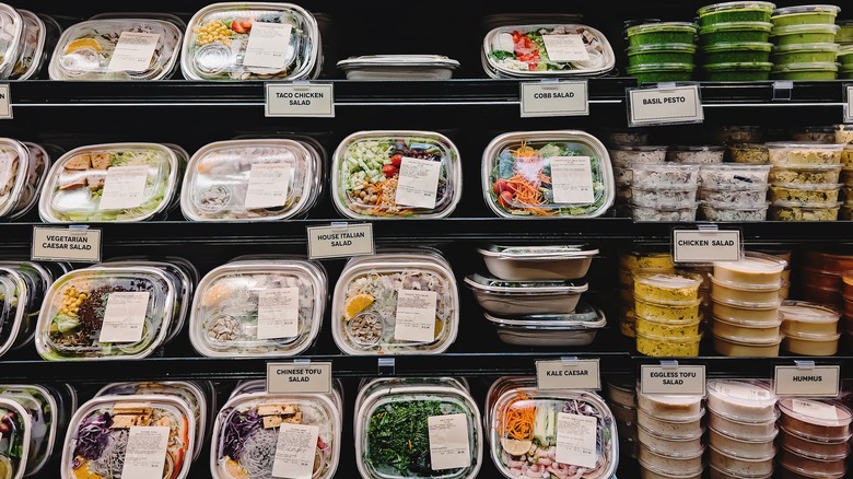 pre-packaged salads on grocery shelf