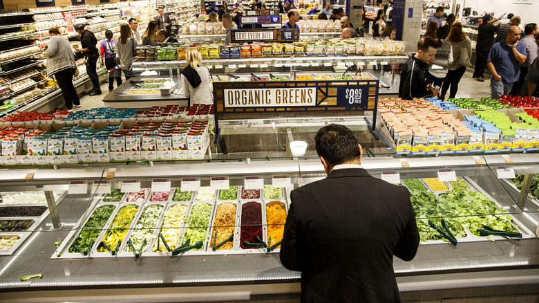 customer looking at salad bar