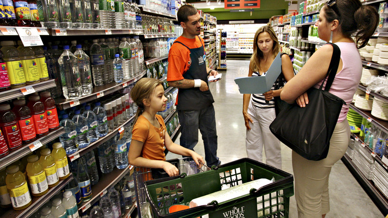 Whole Foods employee assisting shoppers