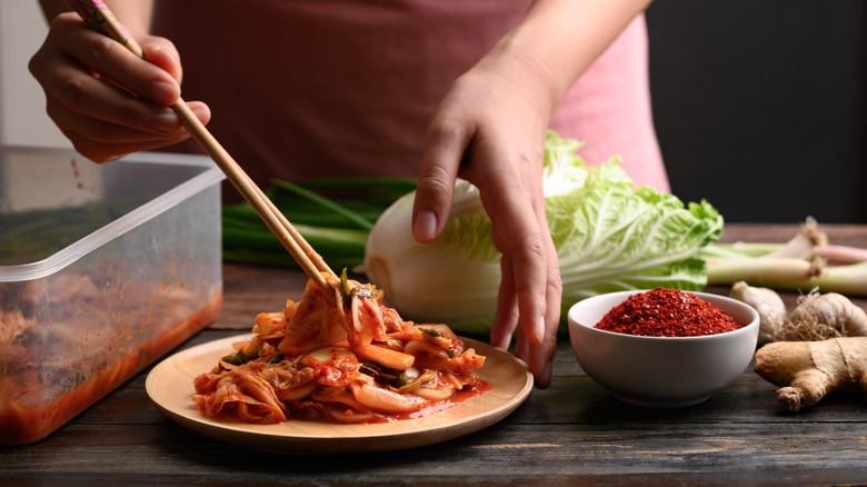 woman making kimchi