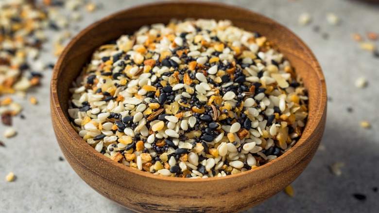 Close-up of everything bagel seasoning in a wooden bowl