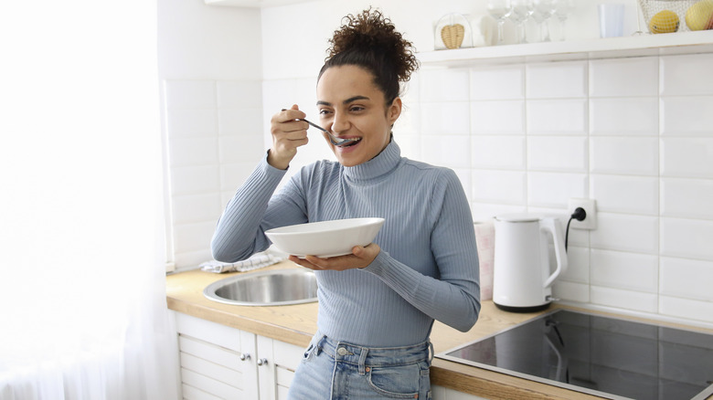 woman eating soup