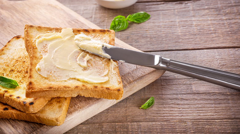 butter on toast with butter knife