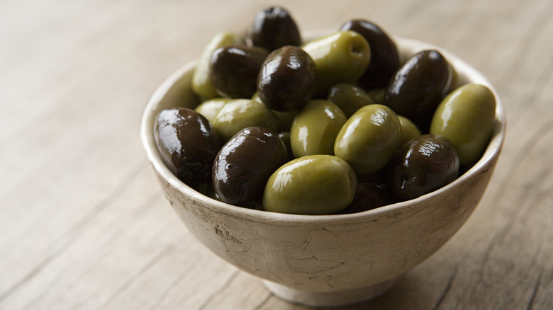 Olives in a bowl on a table