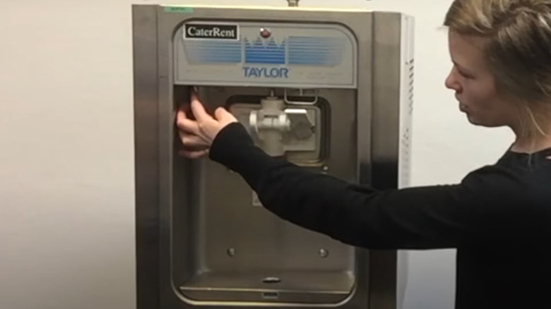 Woman operating ice cream machine