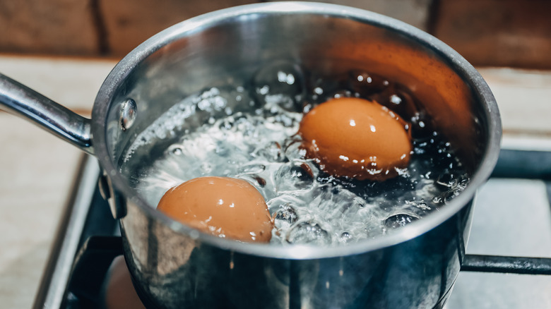 Boiling eggs in silver pot