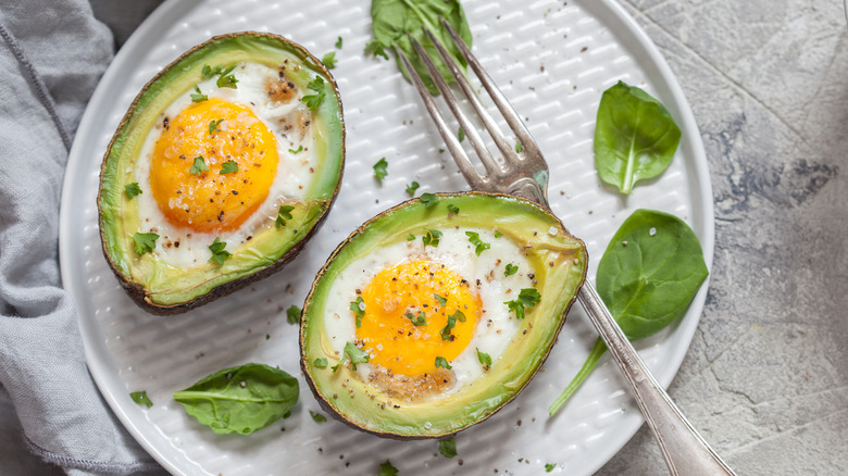 Avocado stuffed with eggs on a plate