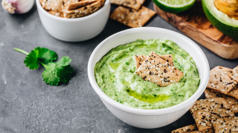 avocado hummus with sesame crackers