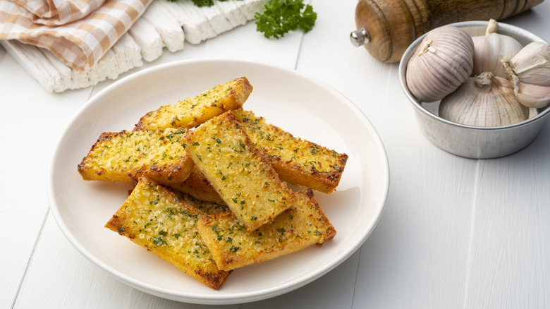 Garlic bread slices on a plate