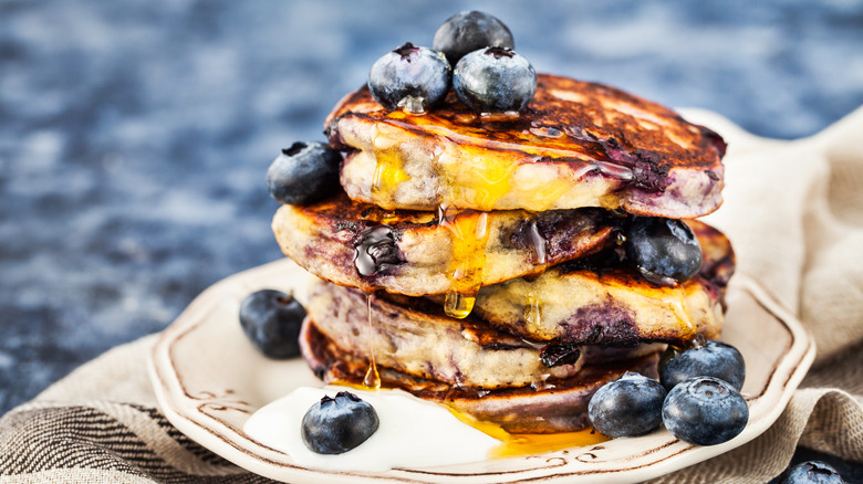 Stack of blueberry pancakes with syrup