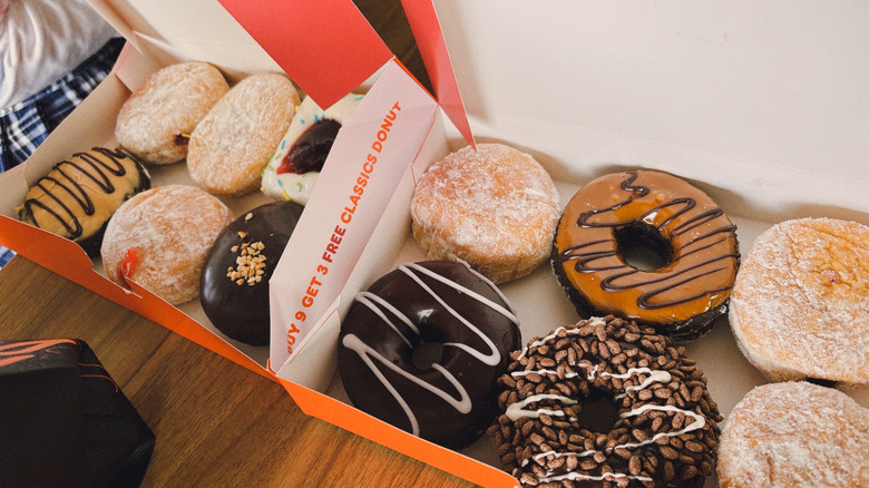 variety of Dunkin' donuts on a white background