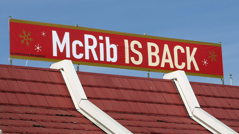 "McRib is back" sign on top of McDonald's building