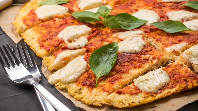 carb-free pizza next to two forks