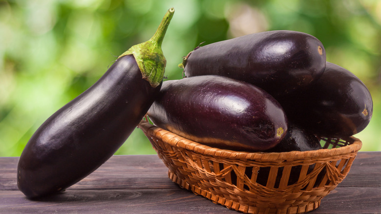 Basket filled with eggplants