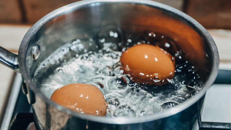 eggs boiling in a metal pot