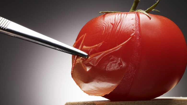 Close up of tomato with skin pierced