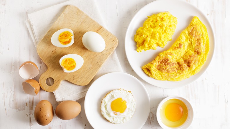 Different preparations of eggs on table