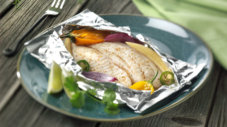 fish in foil on plate 