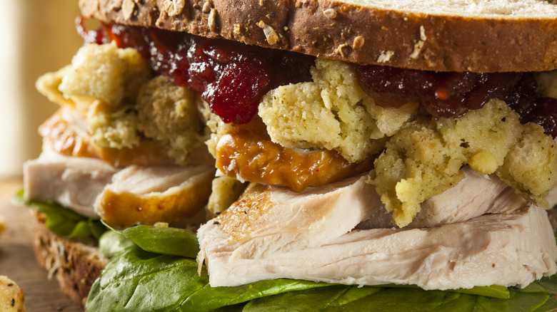 Closeup of turkey stuffing sandwich with cranberry